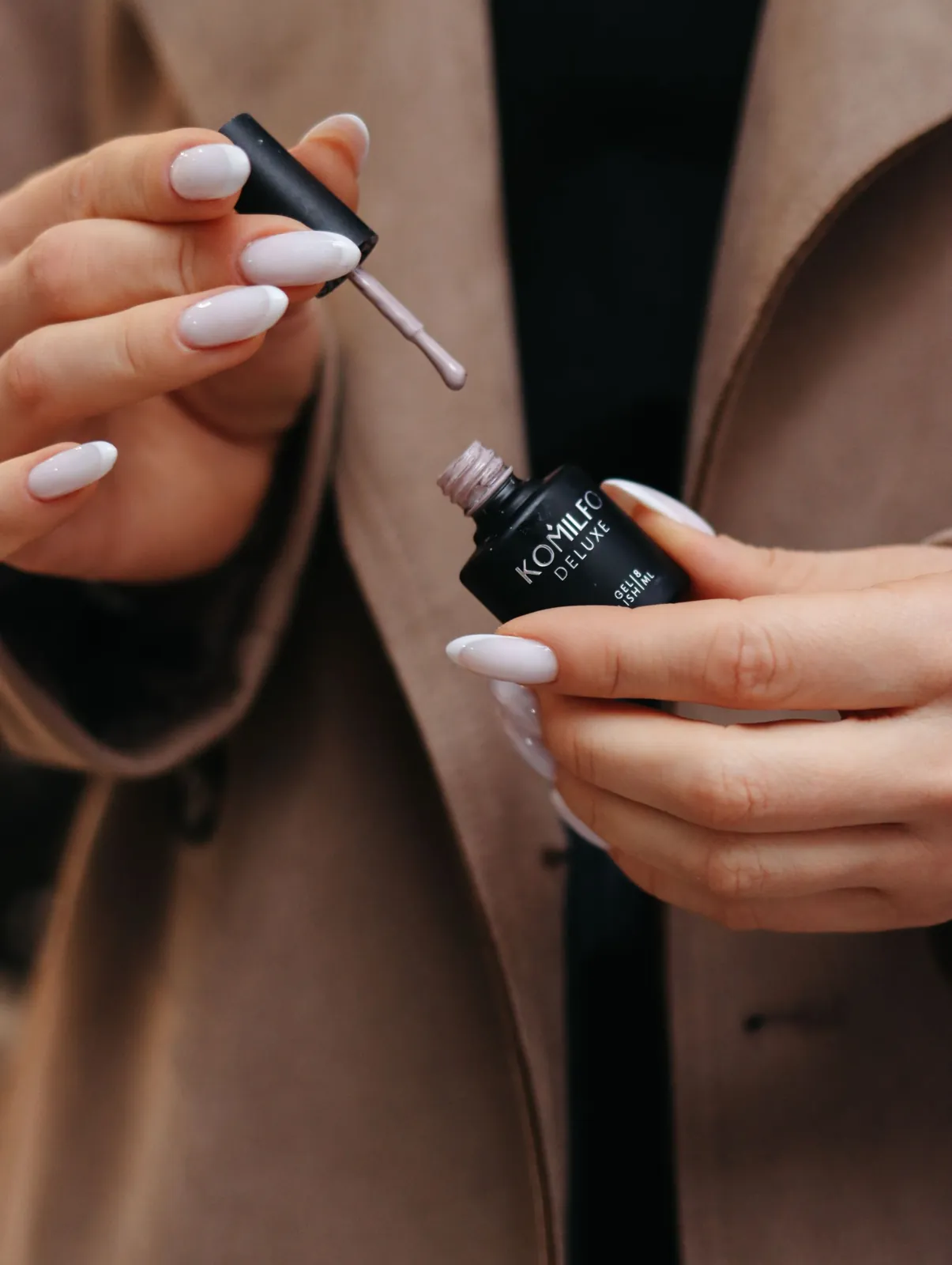Gel product being applied to a prepared natural nail