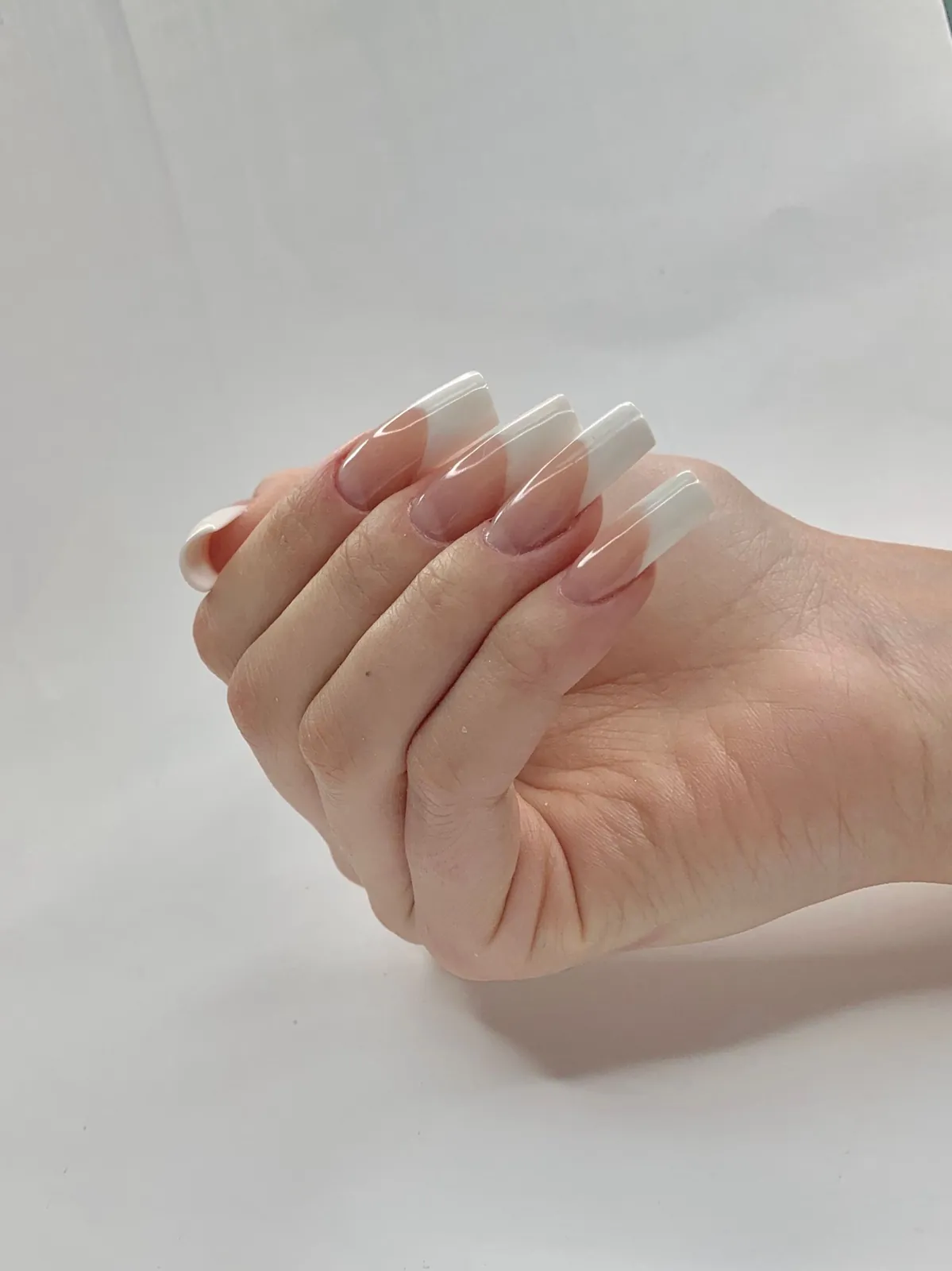 Natural-length nails with a smooth gel overlay and soft French tip